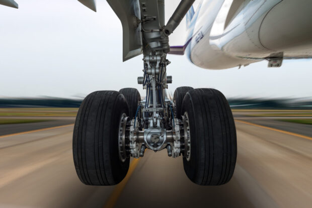 Airplane wheel in a landing gear with motion blur